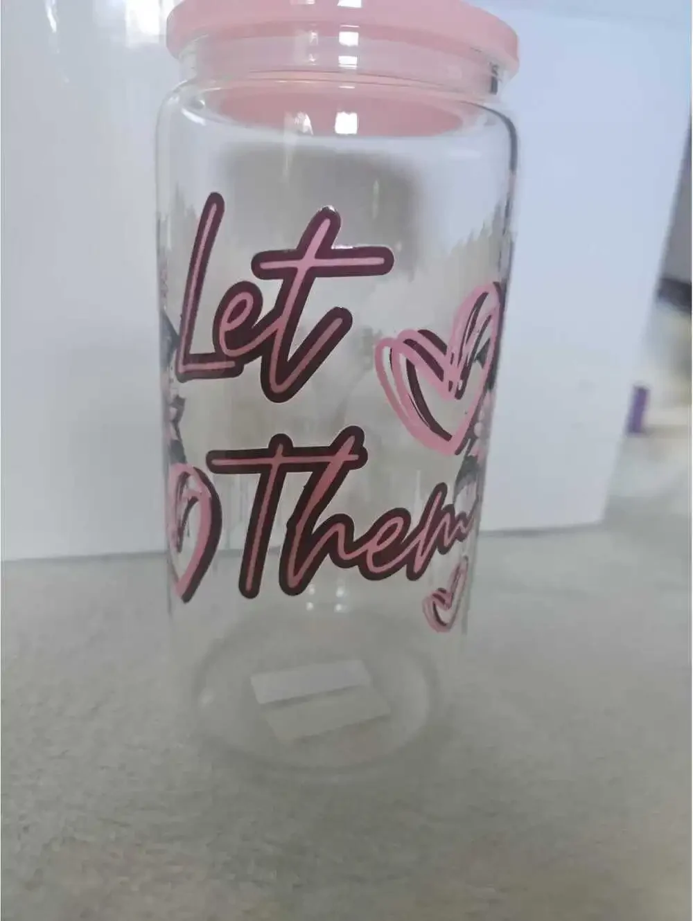 16 oz glass cup with acrylic Lid. Comes w/ straw and straw cleaner.
